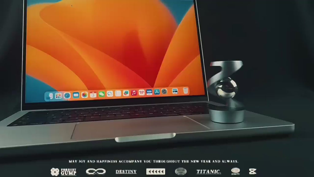 Desk floating gyroscope kinetic stress relief toy rotating smoothly on modern desk, aluminum alloy balance sculpture product showcase video for relaxation and decoration